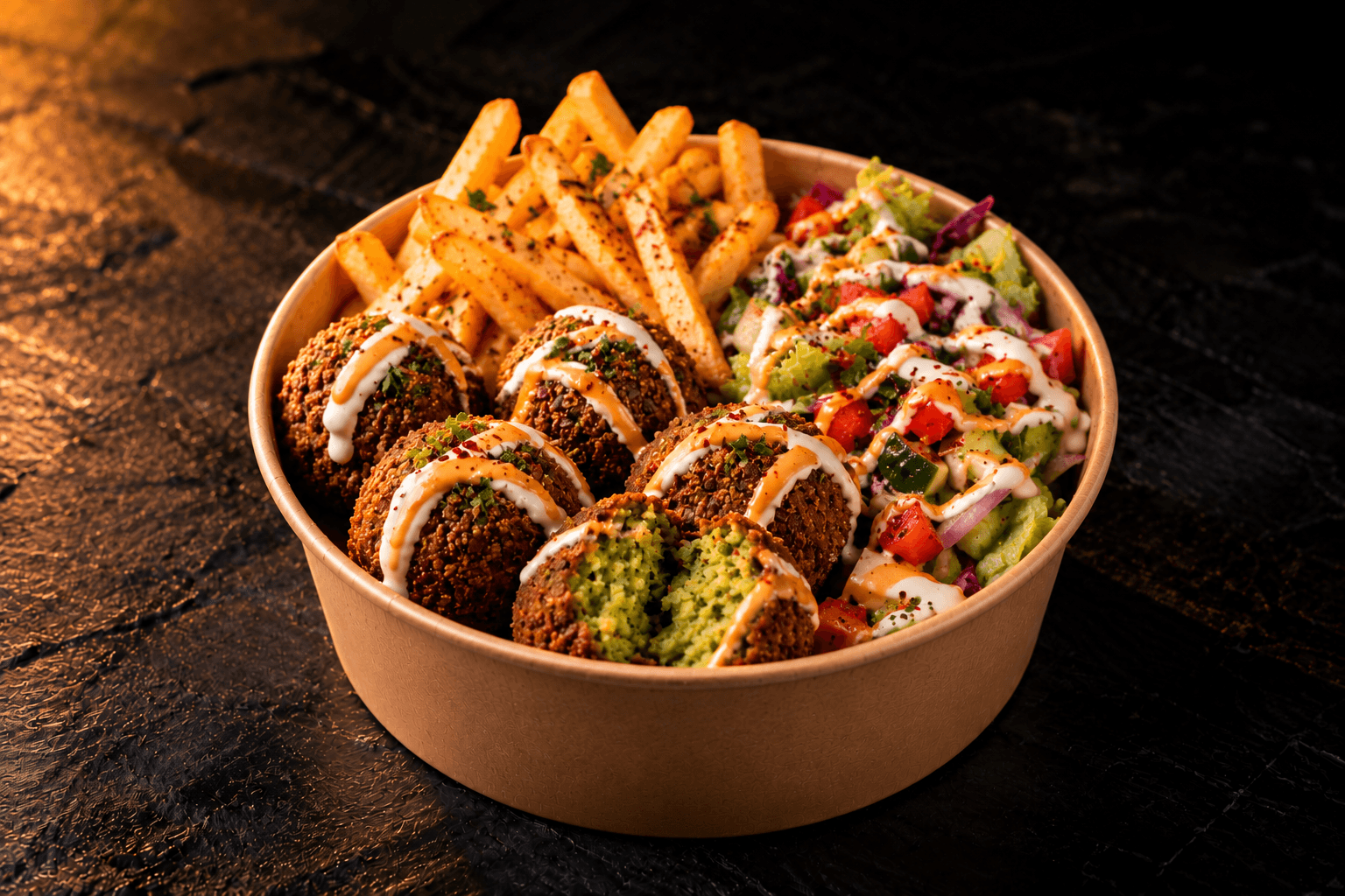 Falafel Box with falafel, hummus, fries and salad in a kraft bowl